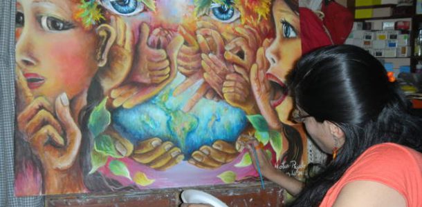 Juana Montes P painting a piece inspired by hearing loss, received a wheelchair from Purinapaq’s mission in Peru and her father received hearing aids